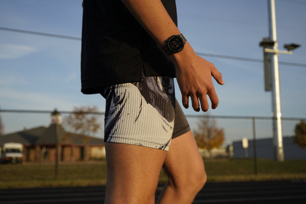 Runner in split shorts on a track