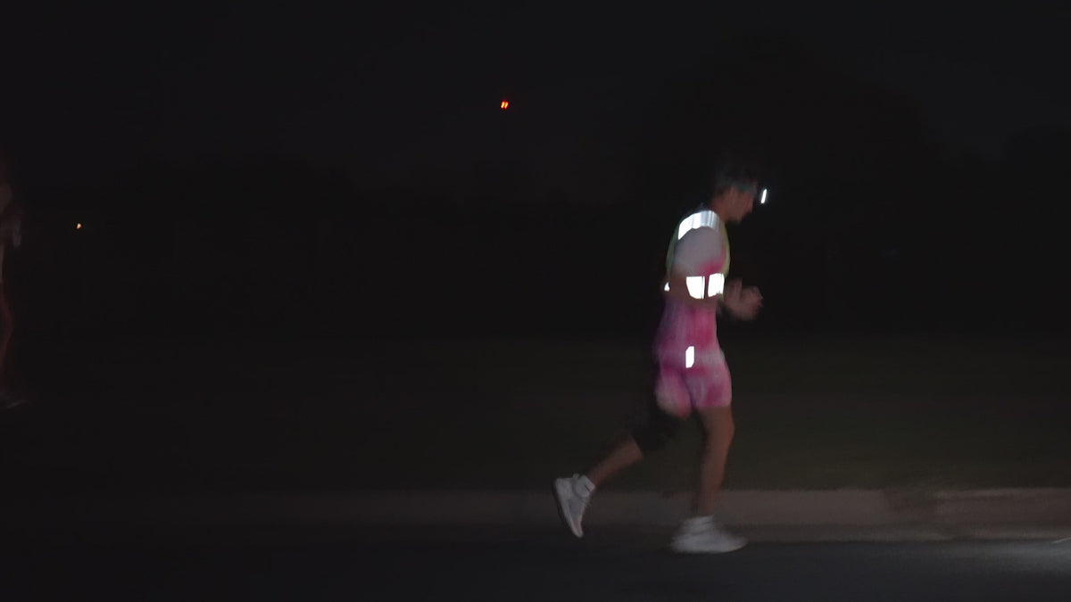 Runners in Run Culture race kit on the track
